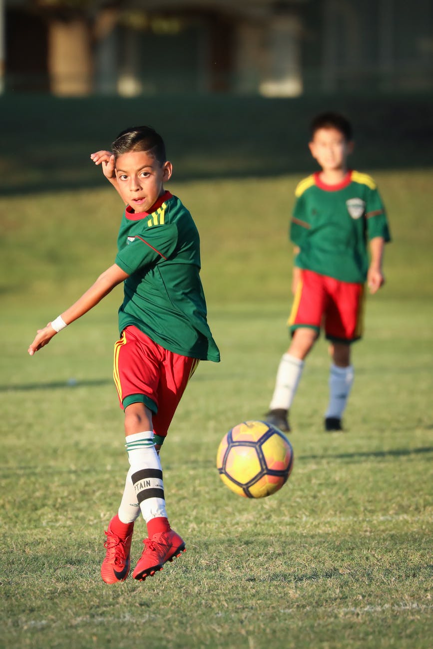 boy playing soccer